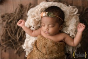 baby girl naturally posed on studio floor