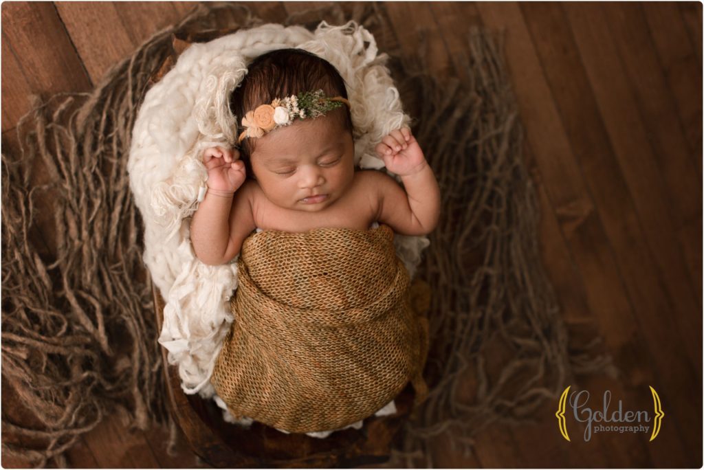 baby girl wrapped and posed in bowl