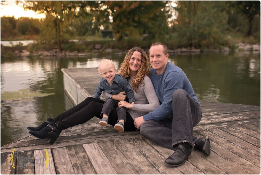 family of three sitting on the docks in Barrington IL