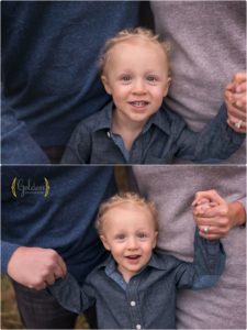 close up of little boy holding mom and dad's hands