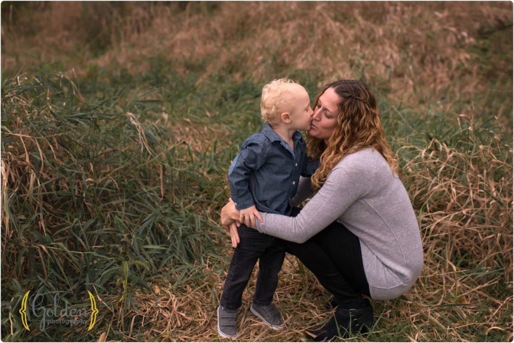 little boy kissing mom outdoors Chicago IL