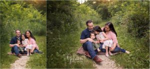 family of four seated in forest preserve in northwest Chicago suburbs