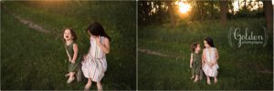 sisters sitting on box in forest preserve at sunset