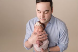 dad holding baby girl
