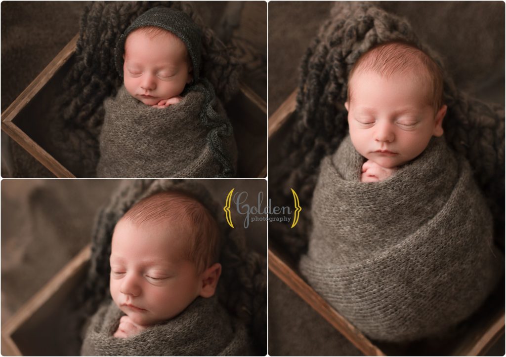 baby boy wrapped in wooden crate