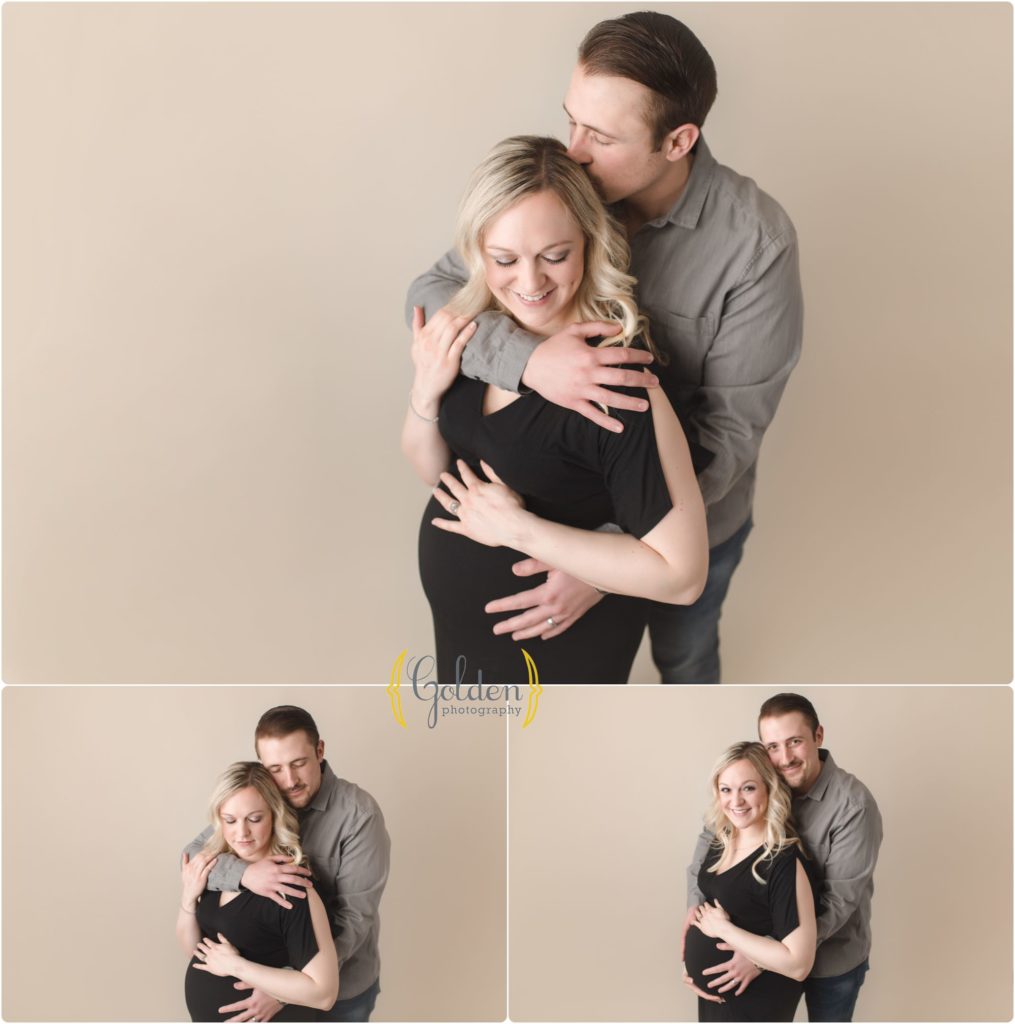 pregnant couple posed in Lake County IL photo studio