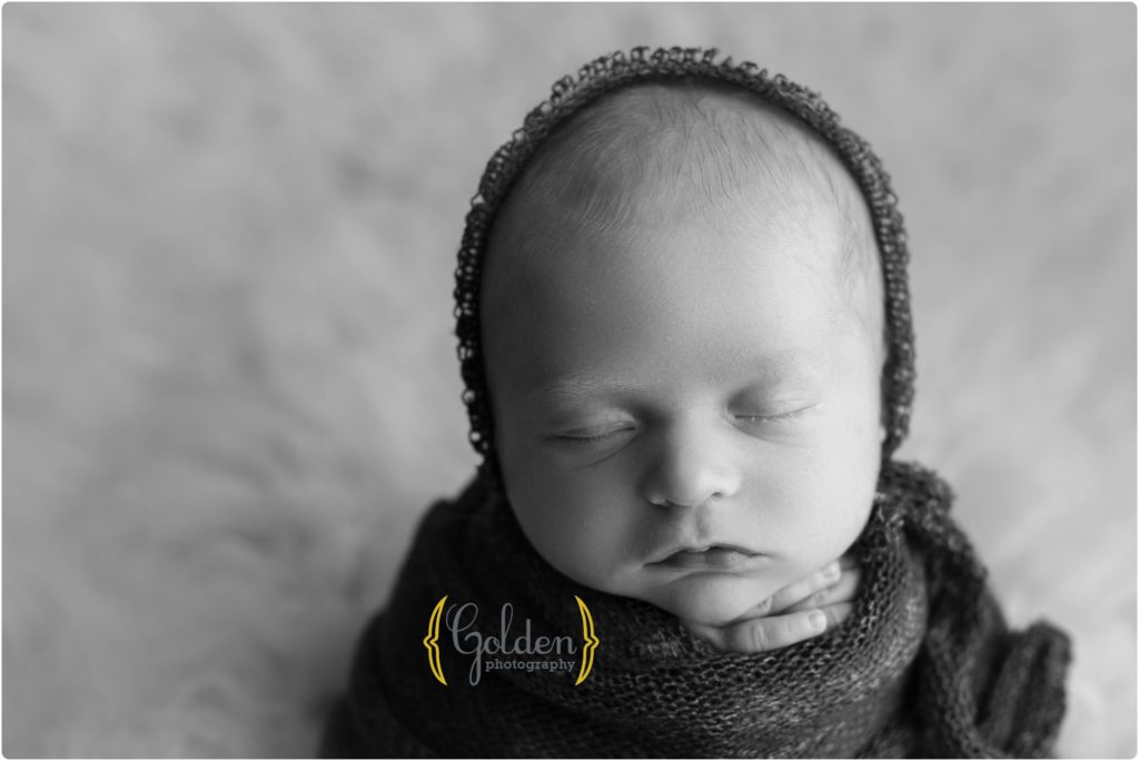baby wrapped and asleep in photo studio near Arlington Heights IL
