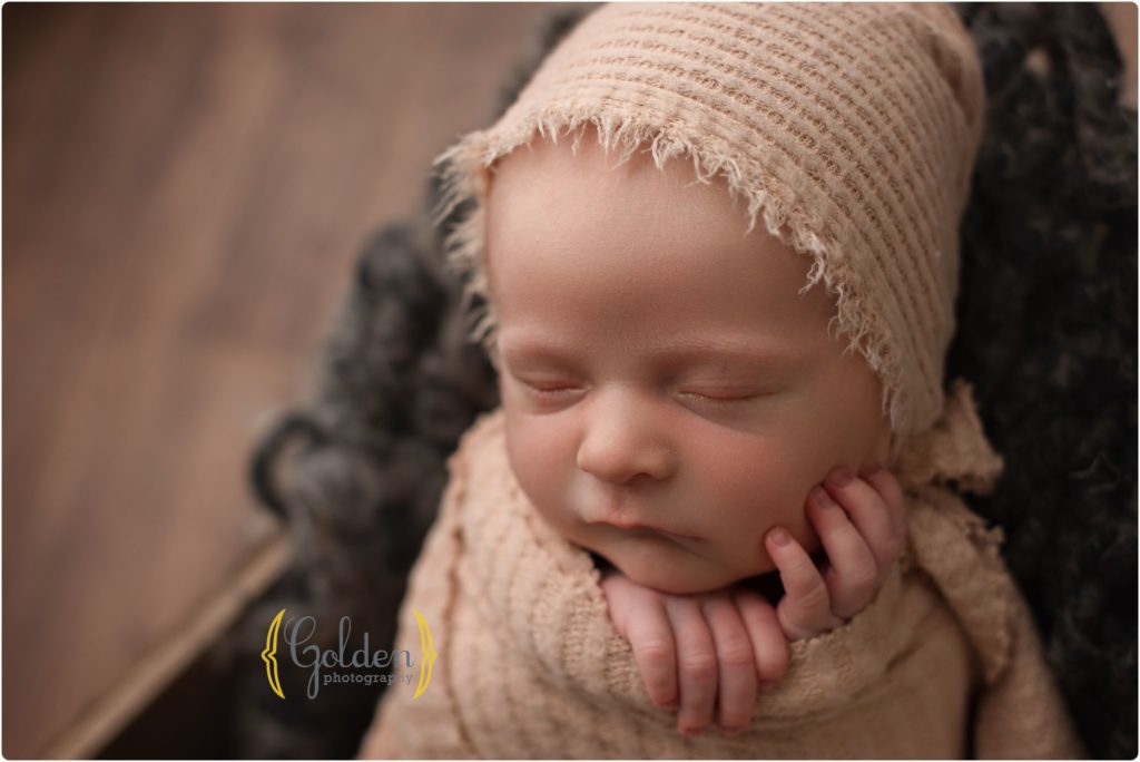 newborn wrapped and sleeping in crate in best newborn photo studio Lake Zurich IL 