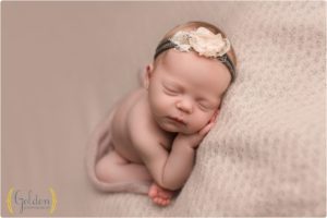 newborn baby girl asleep on blanket in Chicago suburbs photo studio