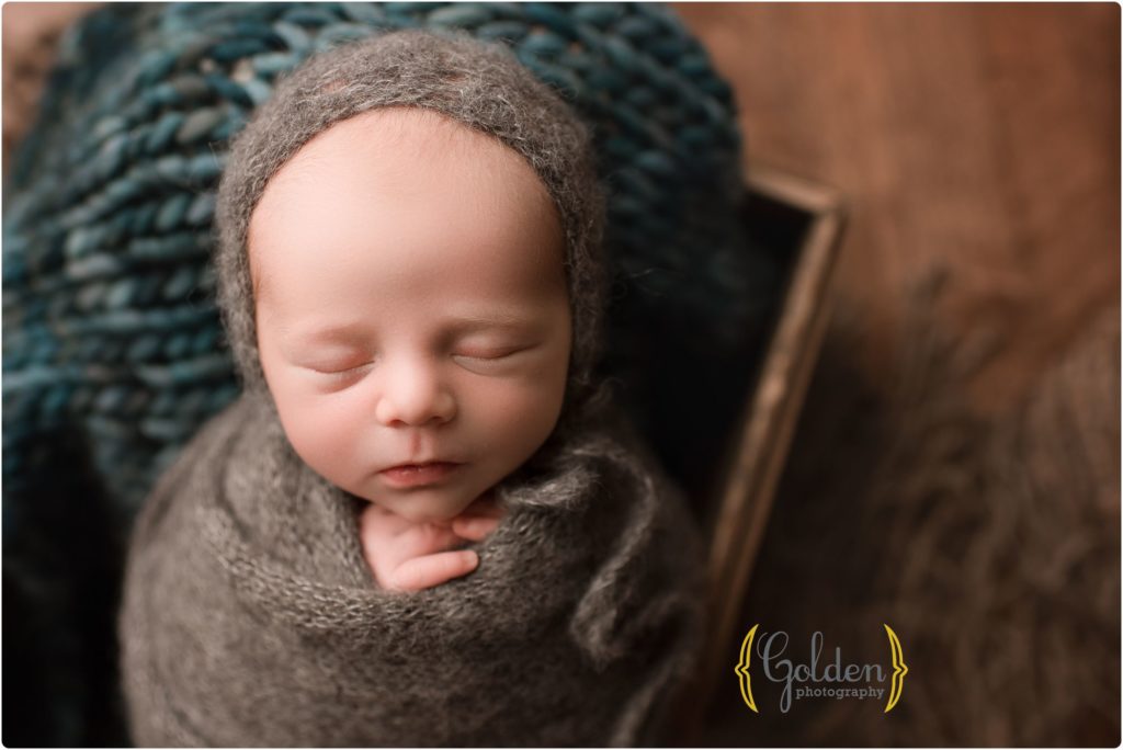 baby wrapped and sleeping in photo studio near Arlington Heights IL