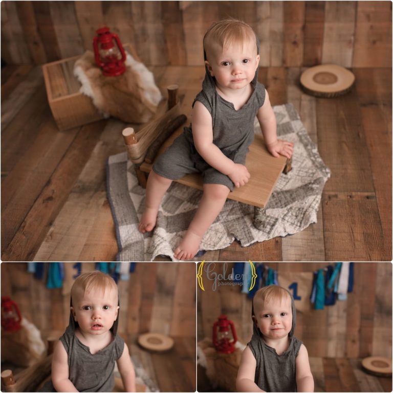 little boy getting 1 year photos done in studio outside Chicago IL