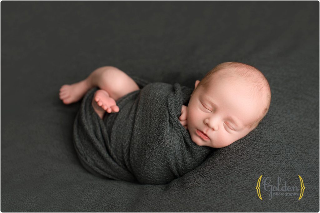 wrapped baby boy sleeping in Libertyville IL photography studio