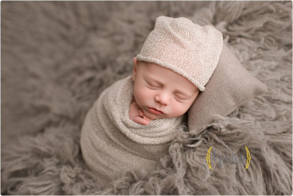 baby sleeping with hat on in photography studio near Vernon Hills IL