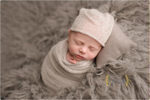 baby sleeping with hat on in photography studio near Vernon Hills IL