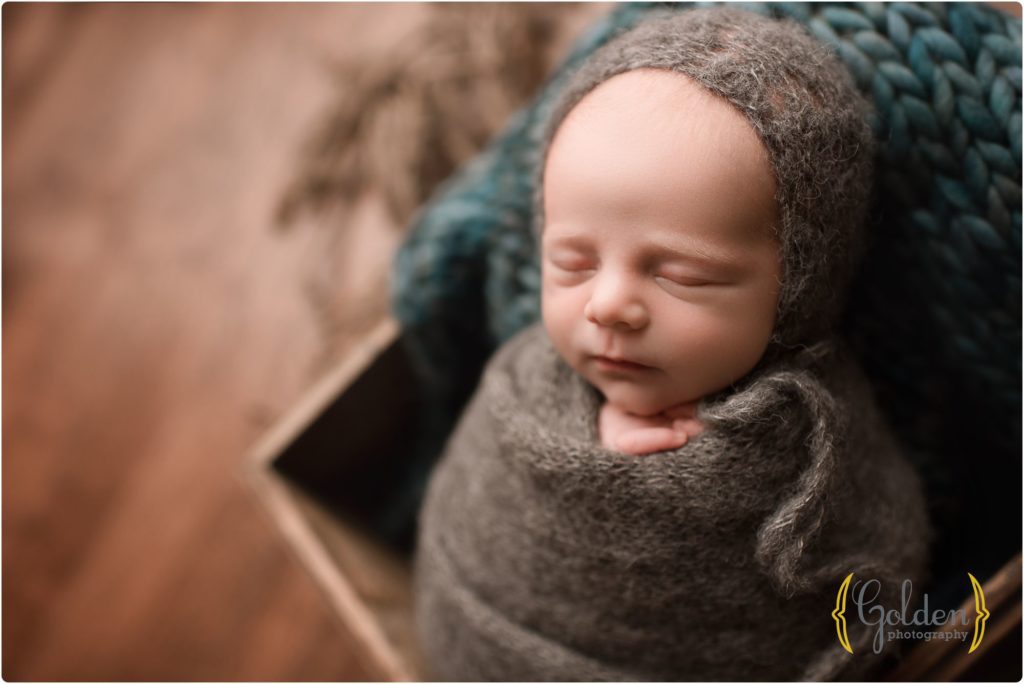 baby boy sleeping in newborn photography studio near Libertyville IL