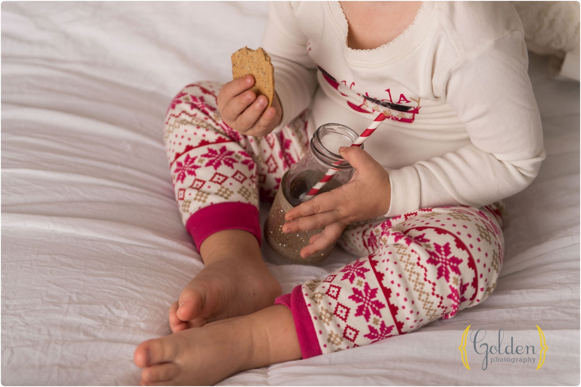child wearing Christmas PJs for photo session near Chicago IL