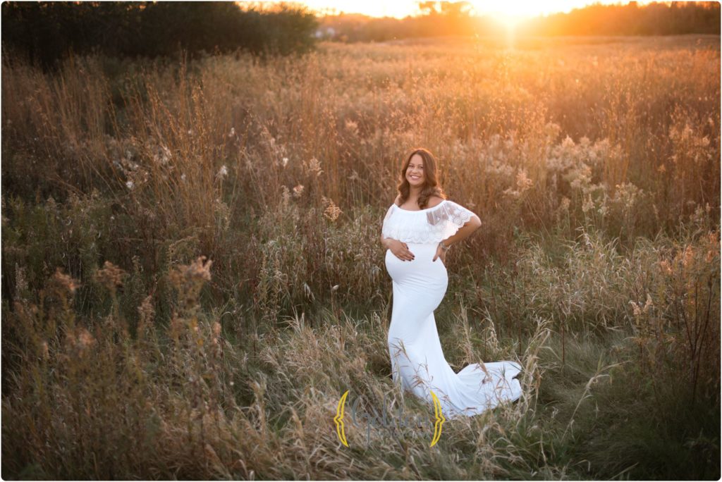 mom wearing white pregnancy dress outdoors Chicago IL
