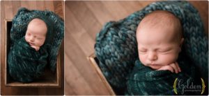 baby boy wrapped in crate in photography studio near Lake Bluff IL