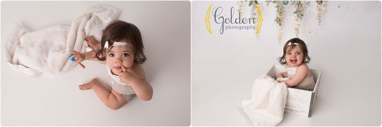 child on white backdrop for first birthday photos near Chicago IL