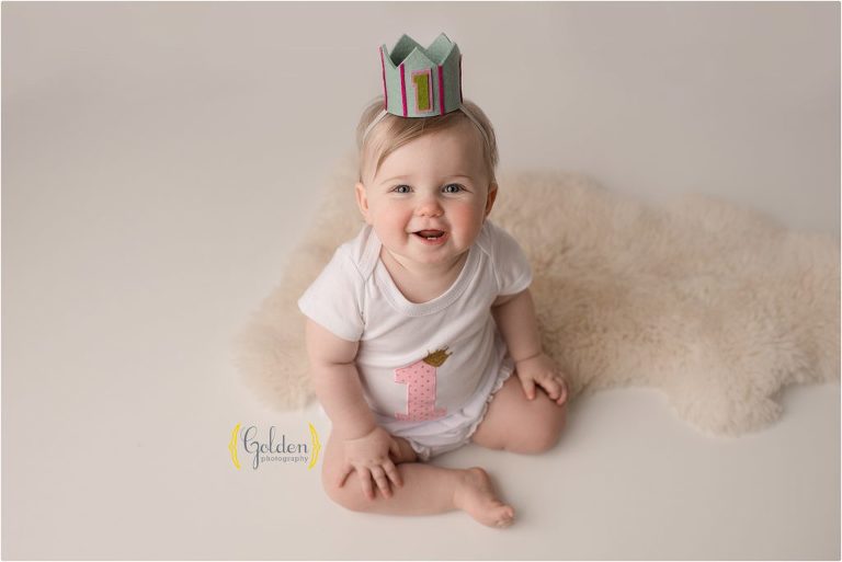 baby girl wearing 1st birthday crown in studio near Chicago IL