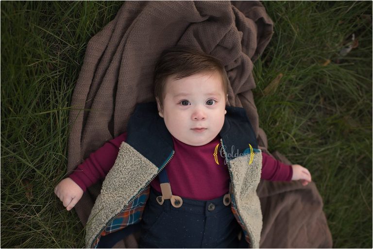 baby laying down for family photos in Lake County IL