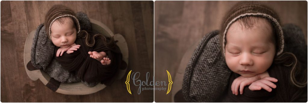 baby boy wrapped in a prop qith Highland park IL newborn photographer