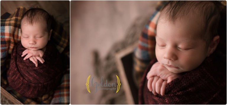 baby boy sleeping in crate for newborn photos in Lake County IL photo studio