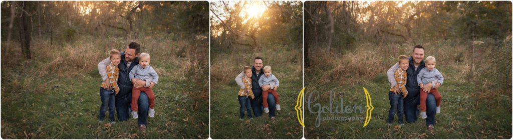 dad poses with two sons at sunset in a park near Buffalo Grove IL