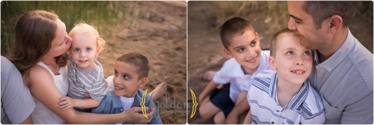 boys cuddling with parents on a beach for family photos