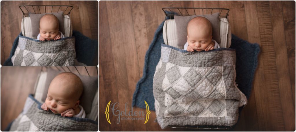 baby boy in tiny bed under quilt in Chicago IL photo studio