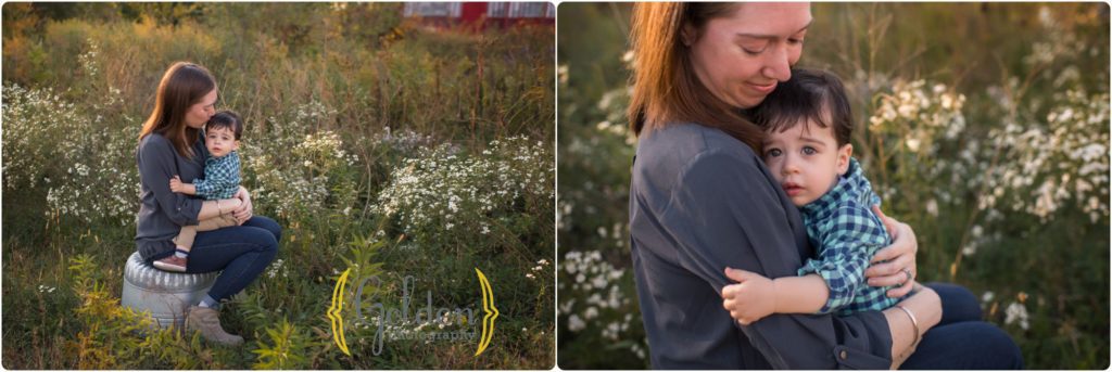 baby boy snuggling his mom for outdoor family portraits in Barrington IL