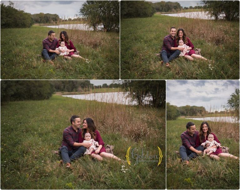 family of three sitting in a field in schaumburg IL forest preserve for family photography