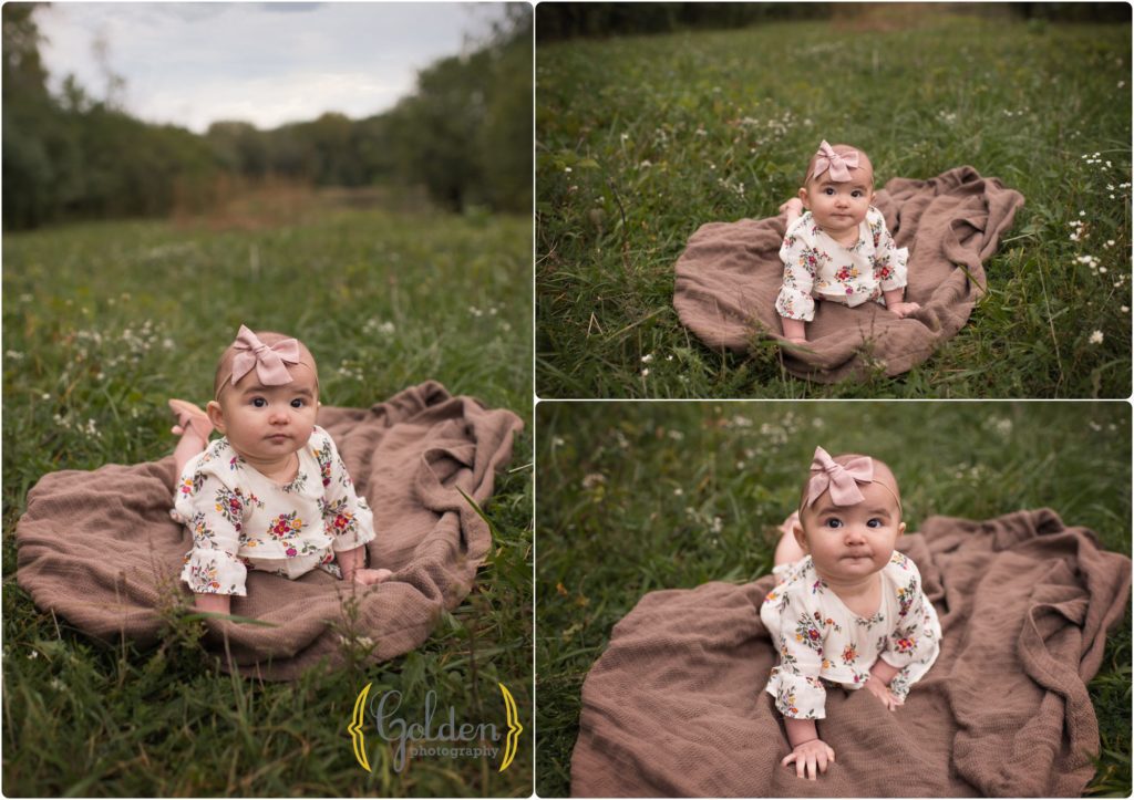 6 month old girl on a blanket during family portrait session in a Schaumburg IL forest preserve
