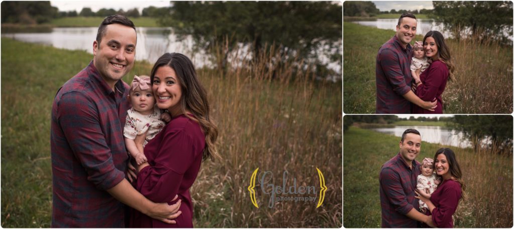 family of three holding baby girl during outdoor photo session in a Schaumburg IL forest preserve