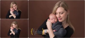new mom holding newborn baby boy at Golden Photography studio.