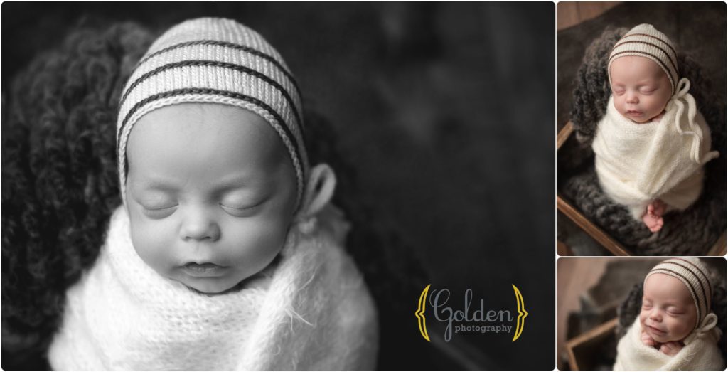 baby boy wrapped in newborn photography studio in Barrington Illinois