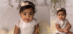 little girl wearing white for first birthday photos in Barrington IL photography studio
