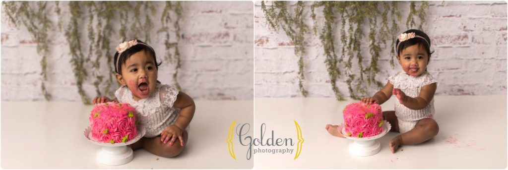 little girl eating smash cake for first birthday photos in Chicago IL studio