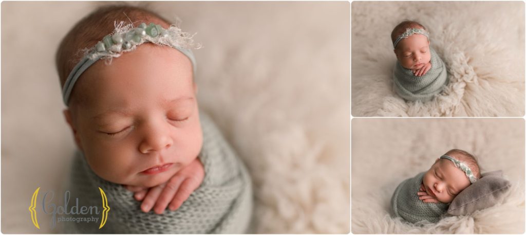 baby girl wearing green wrap in photo studio
