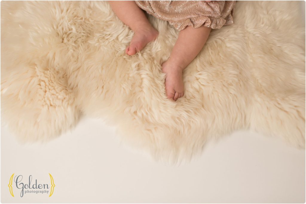 detail of 1 year old feet on fuzzy rug