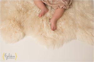 detail of 1 year old feet on fuzzy rug