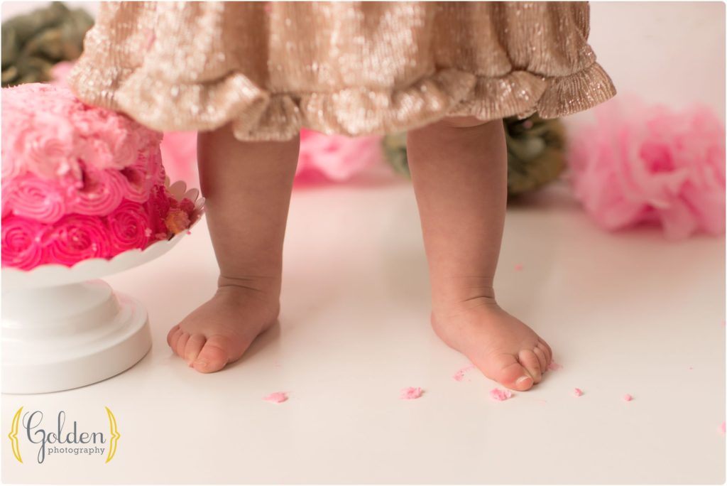 1 year old feet during cake smash photo session