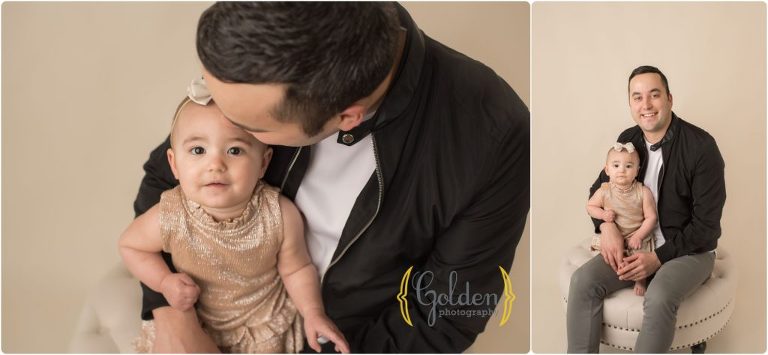 dad holding 1 year old daughter in Lake County photo studio