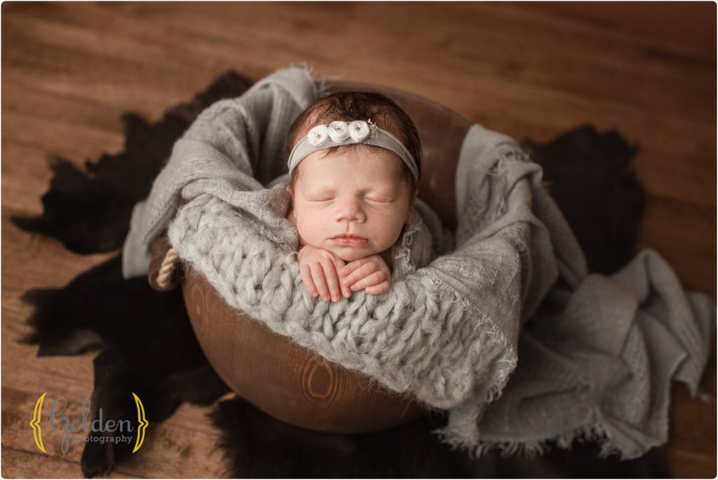 baby girl in wooden bucket near Arlington Heights