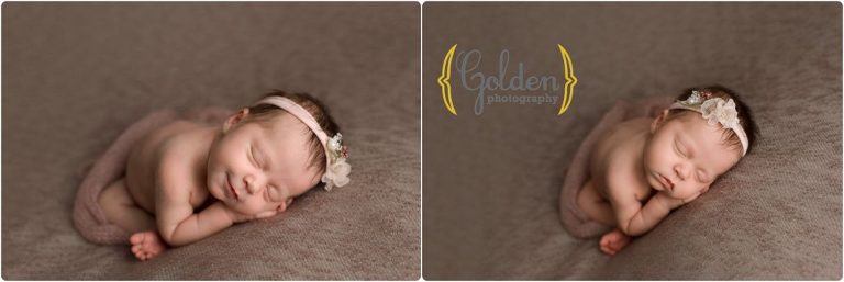 newborn baby girl sleeping in photo studio