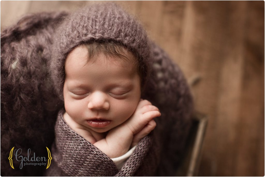 baby girl wrapped in purple in Lake County IL newborn photographer studio