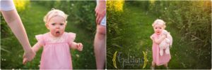1 year old girl holding stuffed bunny outdoors