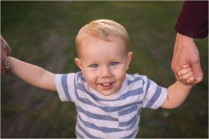 little boy holding hands during Lake County IL photo session
