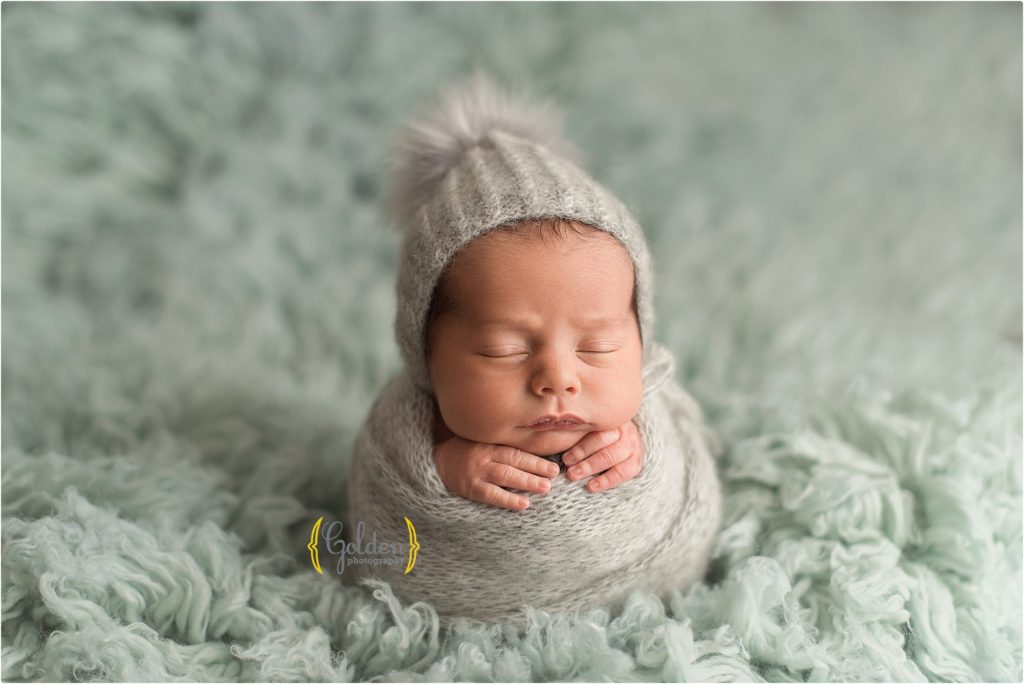 baby swaddled and sleeping on fuzzy rug in Palatine IL