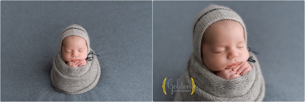 baby boy swaddles in grey on blue cloth with Grayslake IL newborn photographer